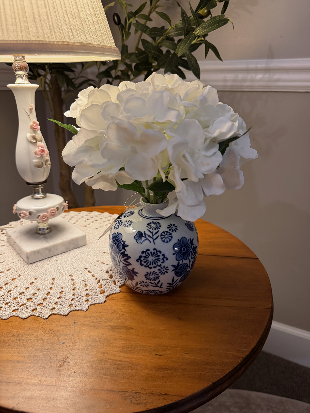 Blue floral ceramic vase with faux flowers